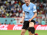 Federico Valverde of Uruguay, Lee Kang-In of South Korea during the FIFA World Cup 2022, Group H football match between Uruguay and Korea Re...