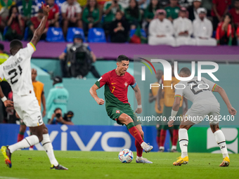 (7) CRISTIANO RONALDO of Portugal team battel on ball with (23) DJIKU Alexander of Ghana team during FIFA World Cup Qatar 2022  Group H foot...