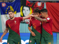 (11) JOAO FELIX of Portugal team celebrate with teammate after score second goal during FIFA World Cup Qatar 2022  Group H football match be...