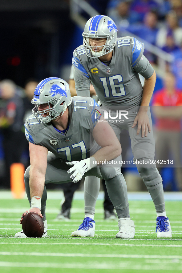 Detroit Lions center Frank Ragnow (77) prepares to snap the ball to Detroit Lions quarterback Jared Goff (16) during an NFL football game be...