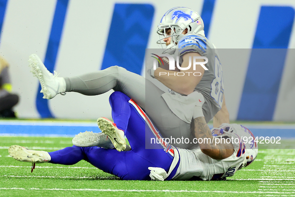 Detroit Lions tight end Brock Wright (89) is taken down by Buffalo Bills cornerback Taron Johnson (7) during an NFL football game between th...