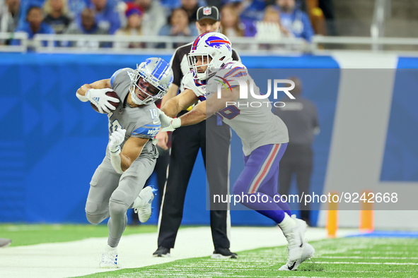 Buffalo Bills linebacker Matt Milano (58) pushes Detroit Lions wide receiver Amon-Ra St. Brown (14) out of bounds during an NFL football gam...