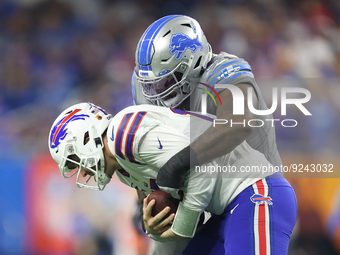 Buffalo Bills quarterback Josh Allen (17) is sacked by Detroit Lions defensive tackle Benito Jones (94) during the second half of an NFL foo...