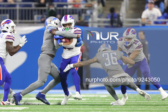 Buffalo Bills running back Nyheim Hines (20) is tackled by Detroit Lions safety Kerby Joseph (31) during the second half of an NFL football...