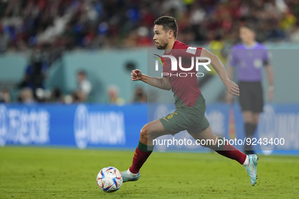 Raphael Guerreiro Left-Back of Portugal and Borussia Dortmund runs with the ball during the FIFA World Cup Qatar 2022 Group H match between...