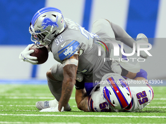 Detroit Lions running back D'Andre Swift (32) is tackled by Buffalo Bills linebacker A.J. Klein (52) during an NFL football game between the...