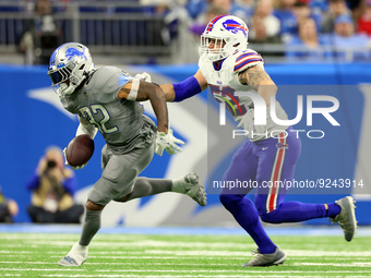 Detroit Lions running back D'Andre Swift (32) is pursued by Buffalo Bills linebacker A.J. Klein (52) during an NFL football game between the...
