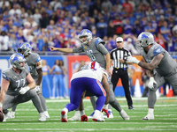 Detroit Lions quarterback Jared Goff (16) gestures at the line before the snap during the second half of an NFL football game between the De...