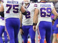 Buffalo Bills place kicker Tyler Bass (2) reacts after missing a field goal during the second half of an NFL football game between the Detro...
