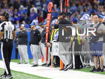 Detroit Lions head coach Dan Campbell follows the play during the second half of an NFL football game between the Detroit Lions and the Buff...