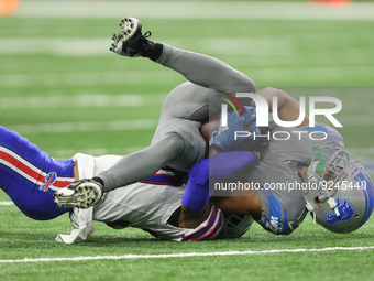 Detroit Lions wide receiver Kalif Raymond (11) is tackled by Buffalo Bills cornerback Dane Jackson (30) during the first half of an NFL foot...