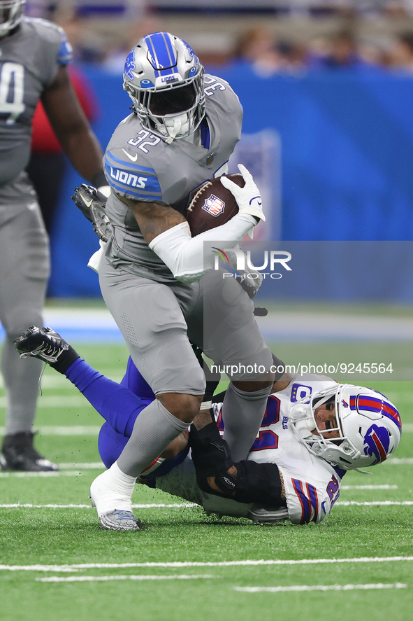 Detroit Lions running back D'Andre Swift (32) is tackled by Buffalo Bills safety Jordan Poyer (21) during the first half of an NFL football...