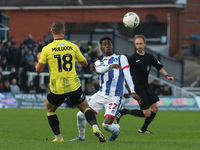 Clarke Oduor of Hartlepool United in action with Harrogate Town's Jack Muldoon during the FA Cup Second Round match between Hartlepool Unite...