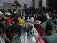 Attendees at the Monumento a la Revolución during the FIFA Fan Fest Mexico in Mexico City, on the occasion of the World Cup match between Me...