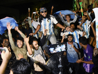 Bangladeshi football fans celebrate Argentina's victory against Mexico at the Dhaka University Area in Dhaka, Bangladesh on 27, 2022. (