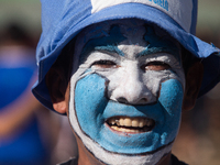 A fan of the Argentine soccer team attends a Fan Fest to watch the match between Argentina and Mexico at the World Cup, hosted by Qatar, in...