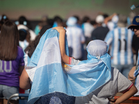 Fans of the Argentine soccer team attend a Fan Fest to watch the match between Argentina and Mexico at the World Cup, hosted by Qatar, in Bu...