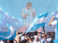 An image of Lionel Messi is seen on a screen as people attend a Fan Fest to watch the match between Argentina and Mexico at the World Cup, h...