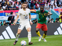 Dusan Tadic (SRB), Nicolas Nkoulou (CMR) during the World Cup match between Cameroon vs Serbia, in Al Wakra, Qatar, on November 28, 2022. (