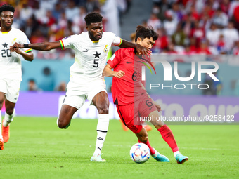 Thomas Partey (GHA), Inbeom Hwang (KOR) during the World Cup match between Korea Republic v Ghana , in Doha, Qatar, on November 27, 2022. (