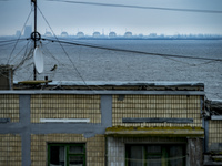 View of  the Zaporizhzhia NPP reactors from the balcony of a building of Nikopol near the right shore of the Dnipro river controlled by ukra...