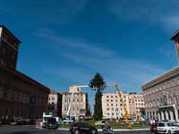 Workers set up a giant Christmas tree in Piazza Venezia on November 29, 2022 in Rome, Italy. (