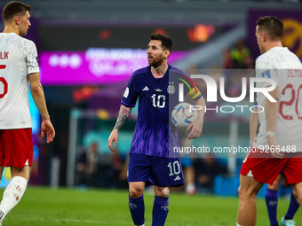 Krystian Bielik (POL), Lionel Messi (ARG), Piotr Zielinski (POL) during the World Cup match between Poland v Argentina , in Doha, Qatar, on...