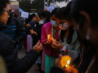 People light candles as they pray for those who have lost their life due to Hiv/Aids, on the eve of World Aids Day in Kathmandu, Nepal Novem...