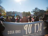 Demonstrators gather outside of the White House in Washington, D.C. on World AIDS Day, December 1, 2022 for a protest hosted by The Myalgic...