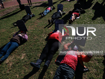 Demonstrators lay on the ground as part of a 'die-in' action outside of the White House in Washington, D.C. on World AIDS Day, December 1, 2...