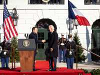 President Joe Biden and President Emmanuel Macron of France shake hands during the arrival ceremony for a state visit, the first for the Bid...