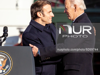 President Joe Biden and President Emmanuel Macron of France shake hands during the arrival ceremony for the Biden-Harris Administration's fi...