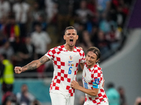 (6) Dejan Lovren and (10) Luka Modric of team Croatia celebrate after won the match and qualify to round 16 at the FIFA World Cup Qatar 2022...