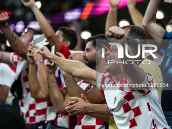 Fans of team Croatia celebrate after won the match and qualify to round 16 at the FIFA World Cup Qatar 2022 Group F match between Croatia an...