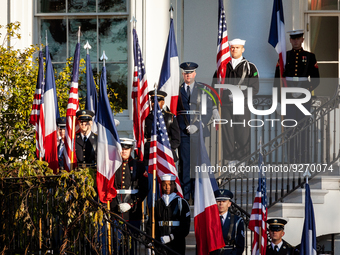 Members of the US military display American and French flags during the official arrival ceremony of President Emmanuel Macron and Mrs. Brig...