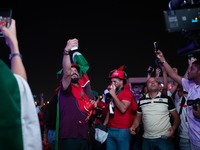 Fans of Morocco celebrate during the FIFA World Cup 2022 Qatar Fan Festival Match between Morocoo V Canda at Al Bidda Park on December 1, 20...
