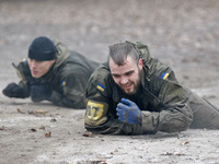 Recruits of the Ukrainian volunteer battalion Azov regiment take part in a final tests after training at the Azov Battalion base,in Kiev,Ukr...