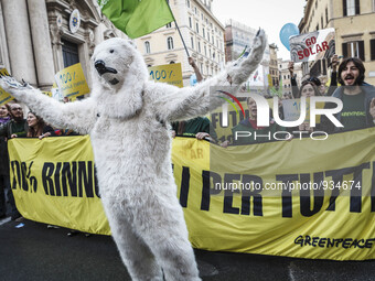 A white bear is seen during the 'Global Climate March' to call for tougher action to tackle climate change in Rome, on November 29, 2015. Th...