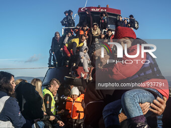 Migrants approach the coast of the northeastern Greek island of Lesbos on Thursday, Dec. 1, 2015. About 5,000 migrants are reaching Europe e...