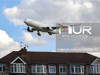 China Eastern Airlines Airbus A330 aircraft as seen on final approach flying over the houses of Myrtle avenue in London a famous location fo...