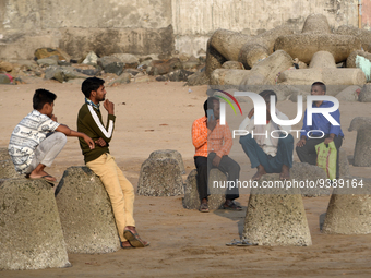 A man talks on a phone near a sea beach in Mumbai, India, 04 January, 2023. Smartphone flattens internet growth curve in India according to...