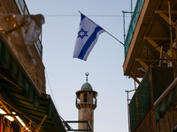 Israeli flag along the Via Dolorosa in the Old Town in Jerusalem, Israel on December 27, 2022. (