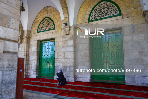 A Muslim woman prays at the Al-Aqsa Mosque in the Temple Mount  in Jerusalem, Israel on December 29, 2022. 