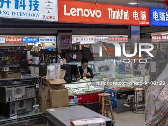 A shop Keeper at a shop inside a shopping center at Huaqiangbei, a popular place to buy electronic goods on January 8, 2023 in Shenzhen, Chi...