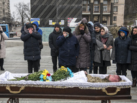 Relatives, friends and comrades attend the funeral ceremony for Oleg Yurchenko, Ukrainian officer, who was killed in a battle against Russia...