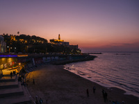 A panorama view on Old Jaffa and Charles Clore Beach during a sunset at the Mediterranean Sea in Tel Aviv, Israel on December 30, 2022. (