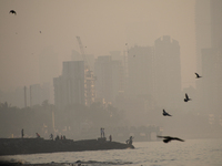 Highrise buildings are seen partially through dense smog in Mumbai, India, 18 January, 2023. Mumbai's Air Quality Index in Mumbai was very p...