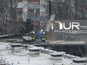 Rescuers work at the site of a helicopter crash near kindergarten,  in the Brovary town, in the outskirts of Kyiv, Ukraine, January 18, 2023...