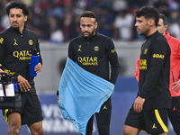 Paris Saint-Germain's Neymar Jr (C) and Marquinhos (L) attend a team training session at Khalifa International Stadium in Doha ,Qatar on 18...