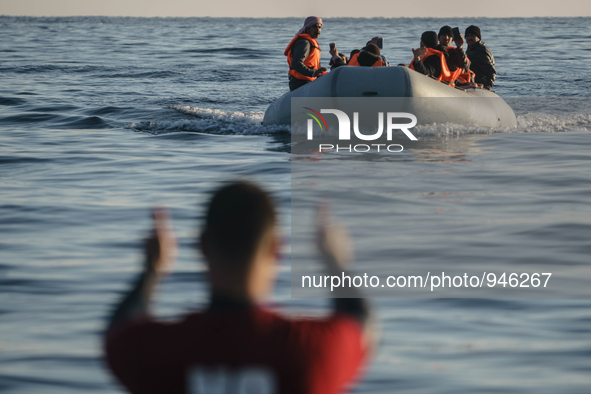 Migrants approach the coast of the northeastern Greek island of Lesbos on Thursday, Dec. 6, 2015. About 5,000 migrants are reaching Europe e...